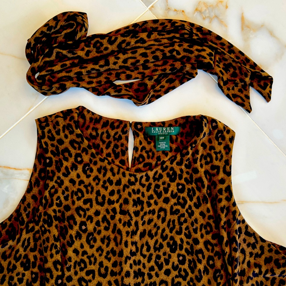 Beautiful tiger print dress with sash. Catch everyone’s eye on the town
